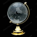 clear crystal world globe with a golden metal stand